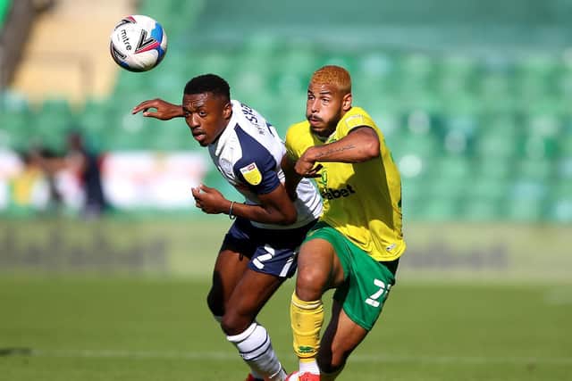 Preston North End right-back Darnell Fisher challenges with Norwich winger Onel Hernandez at Carrow Road