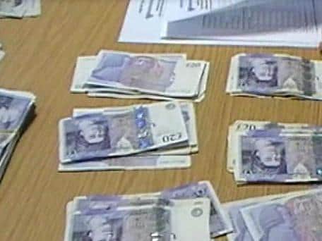 Some of the cash previously seized from a loan shark in Chorley