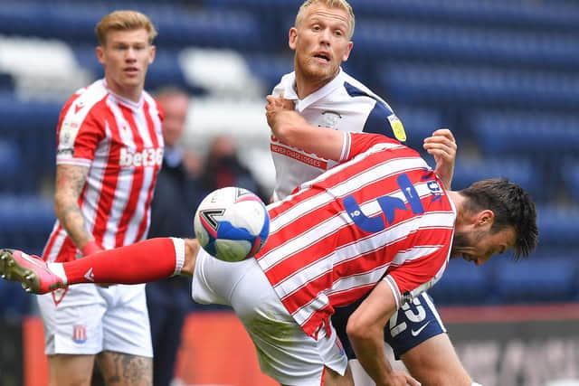 PNE striker Jayden Stockley challenges with Stoke's Morgan Fox