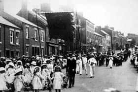 Kirkham and Wesham Club day procession - early 1900s - along Poulton Street, Kirkham, led by little flower girls, with brass band in background