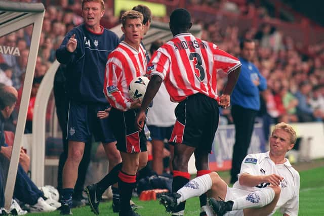 Lee Cartwright doesn't look happy after being left on the ground - watched by David Moyes