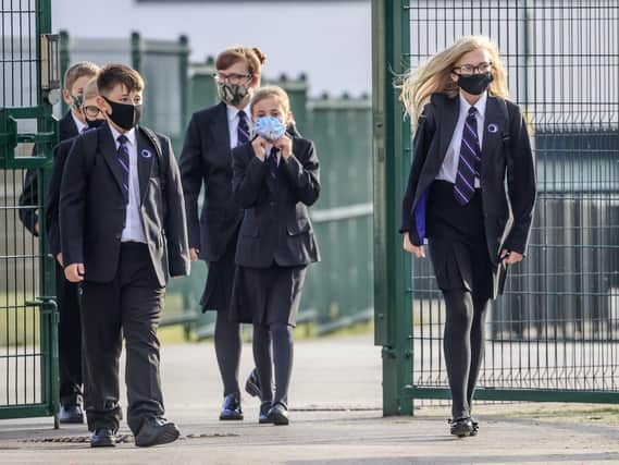 Officials have issued a plea for high school pupils to wear face coverings on Lancashire's school buses