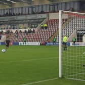 Adam Phillips scores from the spot in Morecambe's win against Port Vale