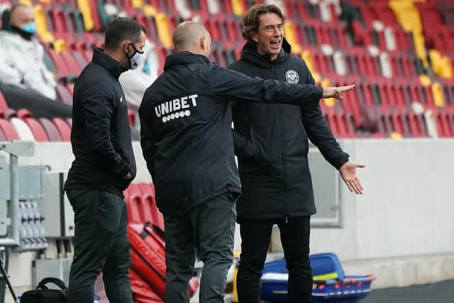 PNE manager Alex Neil and Brentford boss Thomas Frank voice their opinion as fourth official Tim Robinson watches on