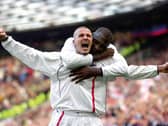 England captain David Beckham celebrates after scoring the equaliser from a free-kick against Greece in the dying seconds of a World Cup qualifier at Old Trafford on October 6, 2001