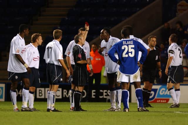 PNE centre-back Claude Davis is shown the red card by referee Scott Mathieson against Leicester