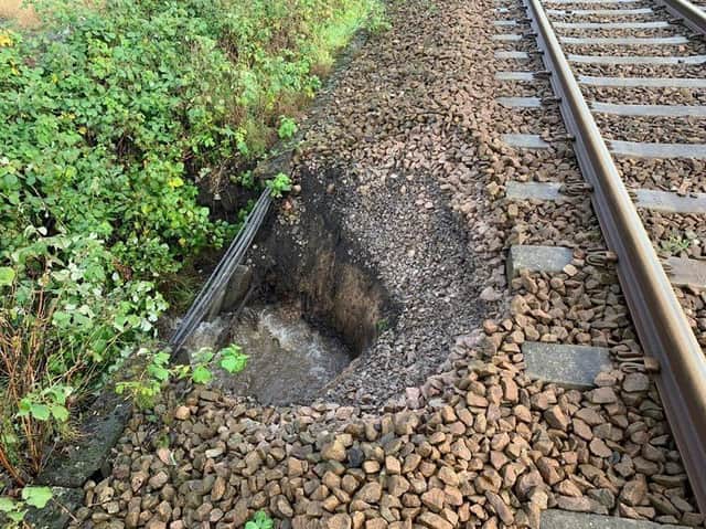 Heavy rain caused part of the embankment supporting the Wigan to Southport line to give way