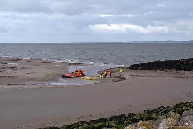 RNLI Morecambe rescued two people and a dog stuck up to their waist in quicksand near the stone jetty in Morecambe.