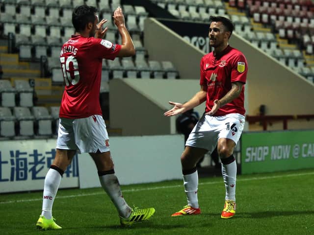 Aaron Wildig and John O'Sullivan had key roles in Morecambe's win at Oldham Athletic last weekend    Picture: Getty Images