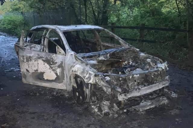 The car was found engulfed in flames in Factory Lane, near the old tramway, in the early hours of Tuesday morning (October 13)