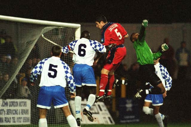 PNE centre-half Michael Jackson sends a header over the bar after getting the better of the Enfield goalkeeper