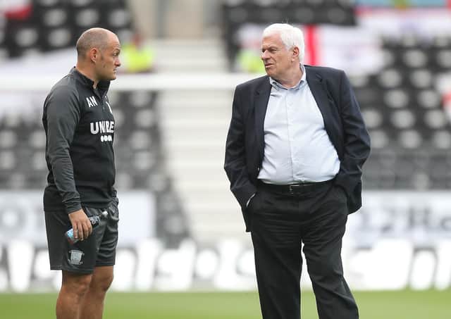 Preston North End manager Alex Neil  talks to Peter Ridsdale