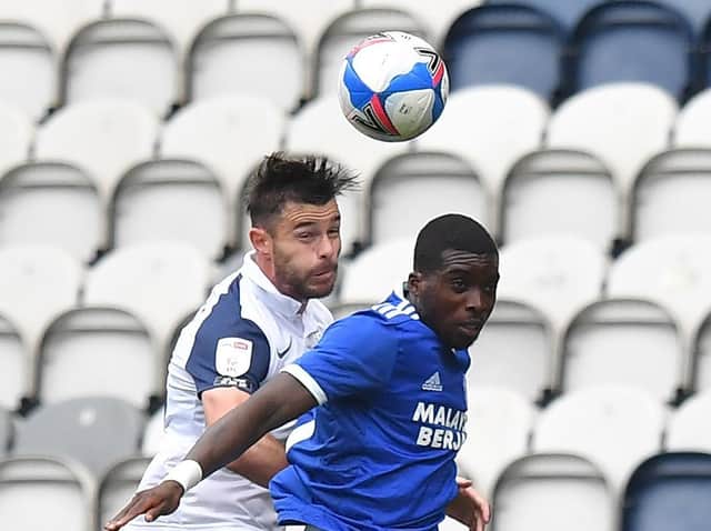 PNE defender Andrew Hughes wins the ball in the air
