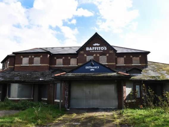 Shuttered up and overgrown, the ravages of a year since Baffito's closed.