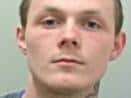 Lee Barr (pictured) has been described as 5ft 4in tall, of slim to medium build, with dark brown hair and blue eyes. (Credit: Lancashire Police)