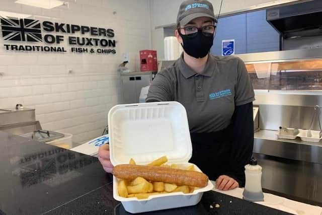 Lauren Pykett serving up free sausage and chips for hungry youngsters at Skippers of Euxton this half-term.