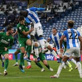 Huddersfield Town’s Mouhamadou-Naby Sarr clears from North End’s Jordan Storey