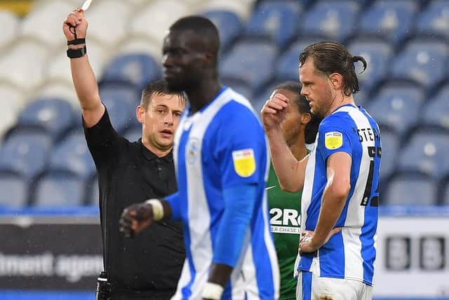 Huddersfield defender Naby Sarr is sent-off for bringing down PNE striker Emil Riis
