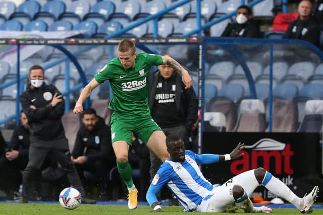 PNE striker Emil Riis gives Huddersfield defender Naby Sarr the slip