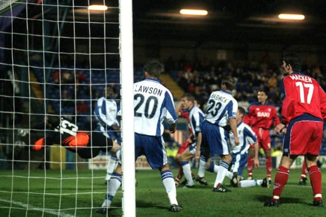 Sean Gregan, out of shot, fires North End's second goal against Bury