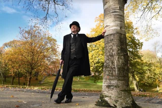 Pete Wilkinson scans his stage in the gardens of Winckley Square....