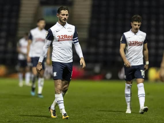 Alan Browne and Josh Harrop leave the pitch after defeat to Millwall.