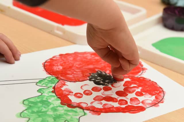 Finger painting is a great way to create the poppies
