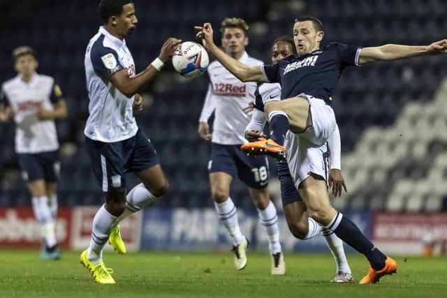 PNE winger Scott Sinclair tries to charge down Murray Wallace's clearance