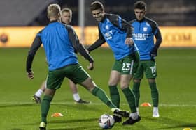 Paul Huntington warms-up with Jayden Stockley and Josh Harrop before the win at Queens Park Rangers