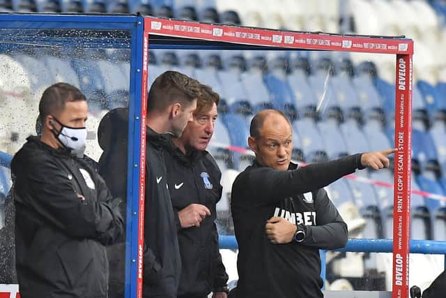 Paul Gallagher (second left) with Steve Thompson and Alex Neil during PNE's win at Huddersfield