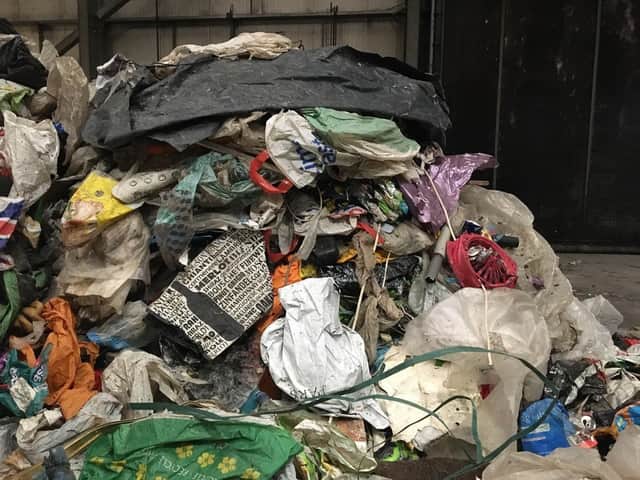 Contaminated waste full of non-recyclable plastic bags and bin liners