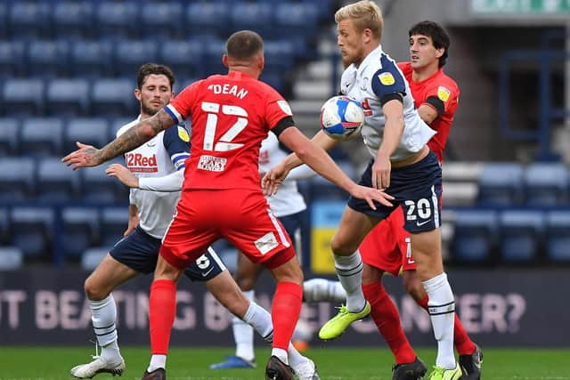 Preston striker Jayden Stockley tussles for possession against Birmingham