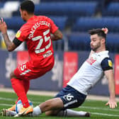 Andrew Hughes tackles Birmingham City's Josh Dacres-Cogley