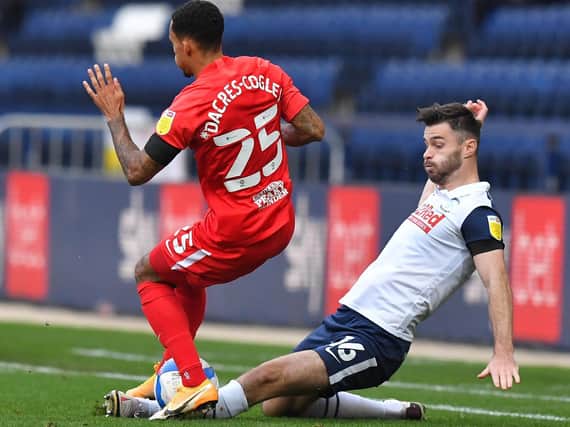 Andrew Hughes tackles Birmingham City's Josh Dacres-Cogley