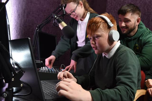 Ingol Community Primary School teaching assistant Nick Pearce works with pupils in the new radio studio



Photos by Neil Cross