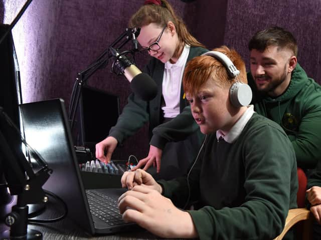Ingol Community Primary School teaching assistant Nick Pearce works with pupils in the new radio studio
Photos by Neil Cross