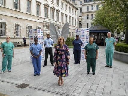Kate Garraway with NHS staff at St Bartholomew's in the City of London where her husband Derek Draper, 53, was first admitted with coronavirus in March 2020. Pic: Daily Mirror Pride of Britain Awards/PA