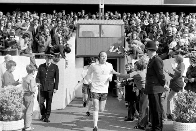 Nobby Stiles runs out of the tunnel at Deepdale