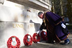 Mayor of Preston Coun David Borrow lays a wreath at the city's War Memorial.