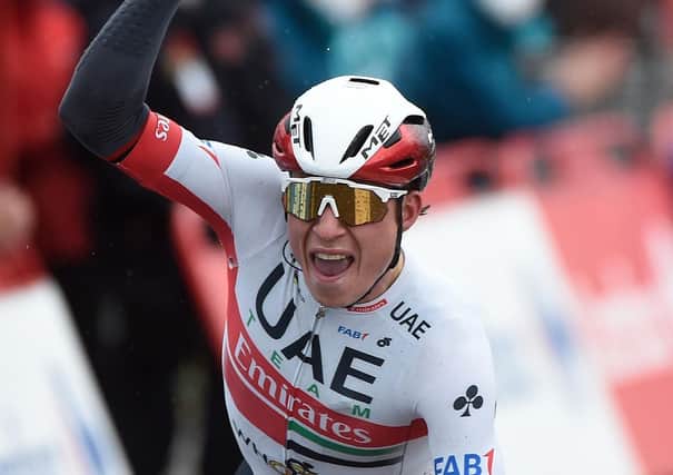 Jasper Philipsen celebrates as he crosses the finish line of the 15th stage of the 2020 La Vuelta (photo by Miguel Riopa/AFP via Getty Images)
