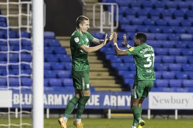 Emil Riis is congratulated by Scott Sinclair after scoring his first goal in a Preston shirt
