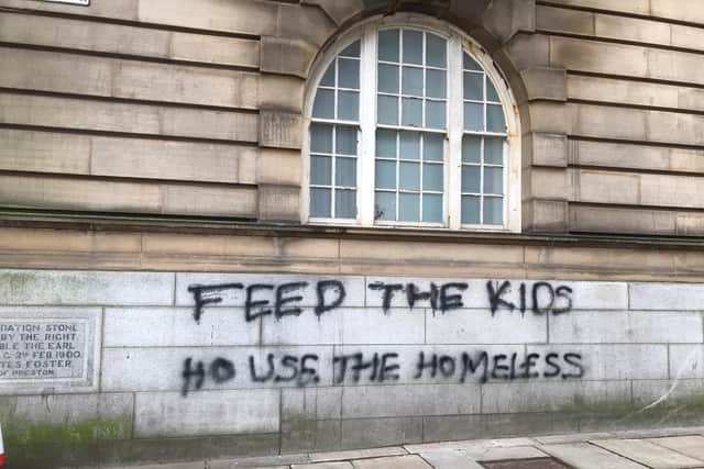 Messages read 'feed the kids' and 'house the homeless'