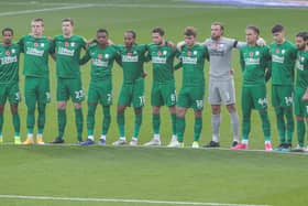 PNE players observe a minute’s silence before the game