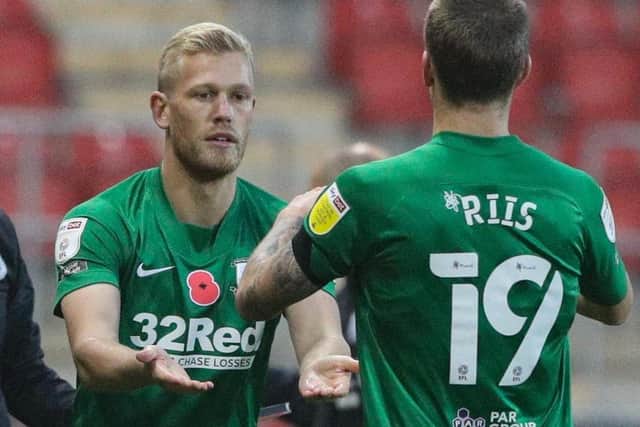 Substitute Jayden Stockley (left) hit the post in stoppage time to almost earn a point for PNE at Rotherham