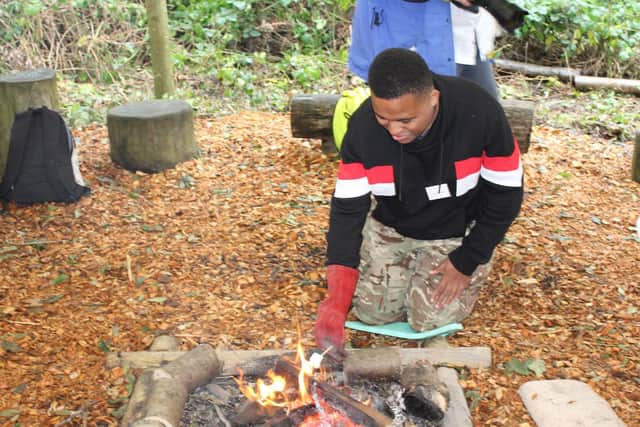 Myplace participants toasting marshmallows