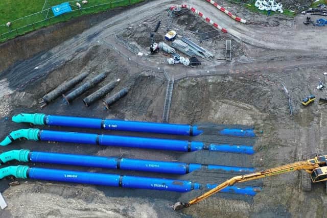 An aerial view of the four new pipes showing the old section of Haweswater Aqueduct which has been replaced