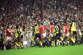 United and Arsenal players clash at Old Trafford in 1990