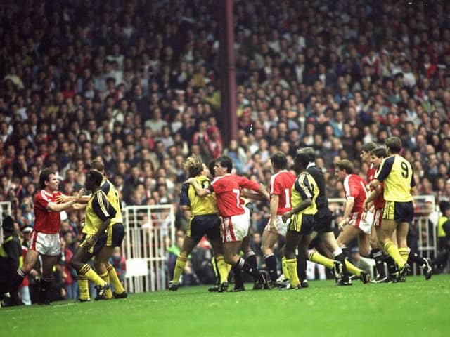 United and Arsenal players clash at Old Trafford in 1990