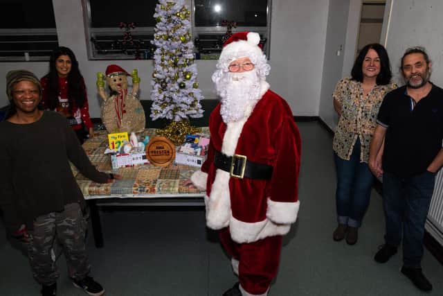 Christmas comes early as Father Christmas and volunteers (l-r) Brandee Anderson, Afeefa Ali, Claire Foster and Philip Matthews help with the Christmas Shoebox Appeal: Preston Edition