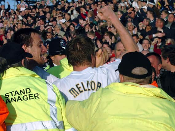 Neil Mellor celebrates with the Preston North End fans at Blackpool's Bloomfield Road ground in November 2008